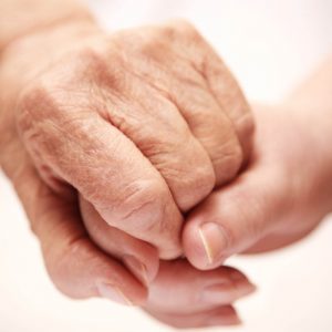 Close-up picture of two people holding hands