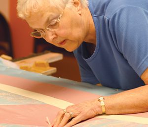 Woman quilting