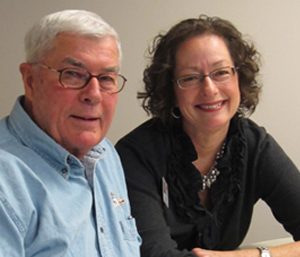 man and woman smiling