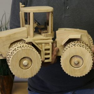 Hand-carved wooden tractor