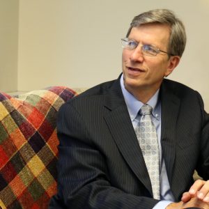 Man smiling on couch