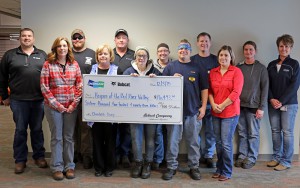 Bobcat Company Employees present a check for more than $16,000 to Hospice of the Red River Valley