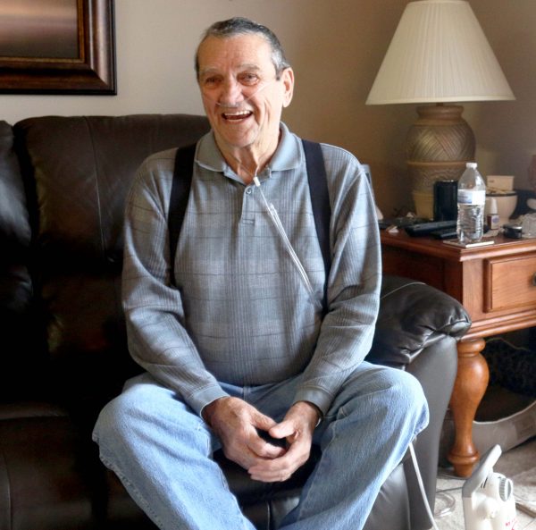 Bill Kelly sits on his couch in his south Fargo living room.