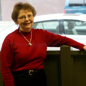 Judy Dragseth_senior women standing in front of a window