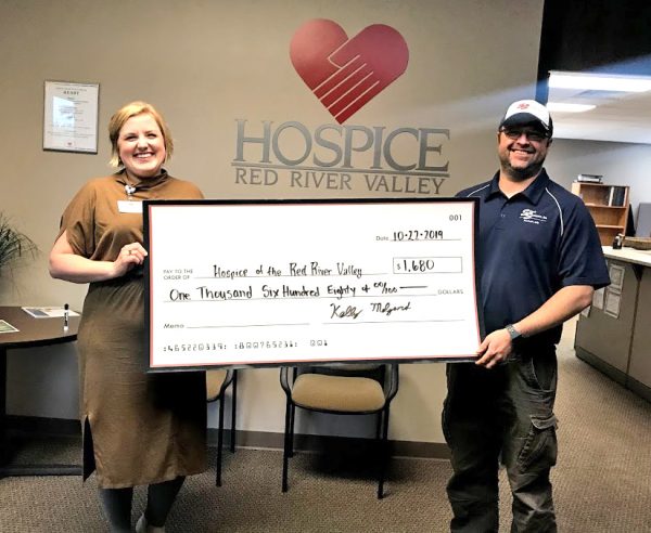 Steve's Sanitation presents a $1,680 to Hospice of the Red River Valley