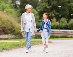 girl walking with grandma