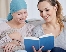 woman reading to another woman