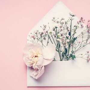 envelope with flowers coming out