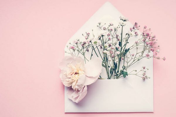 envelope with flowers coming out