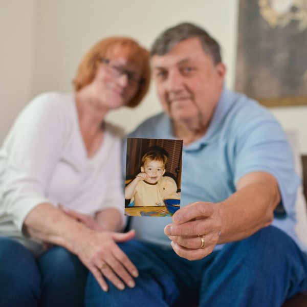 Pat and Larry Kerian holding a photo of their son Steven.